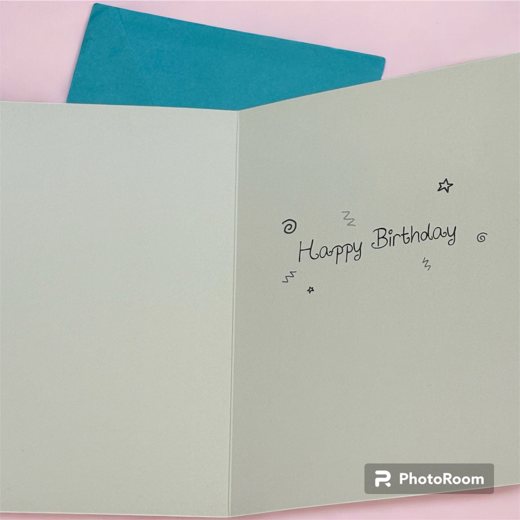 Light green card with 'Happy Birthday' text on a pink background.